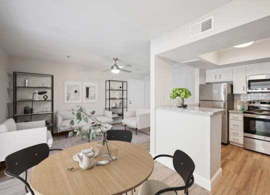 Model dining space and view of kitchen