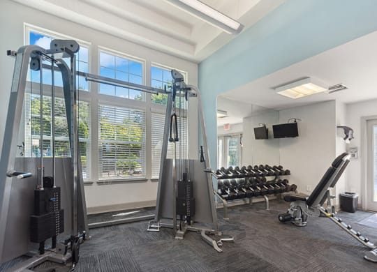 Community Fitness Center with Equipment and TV's at The Commons at Haynes Farm Apartments in Boston, MA.