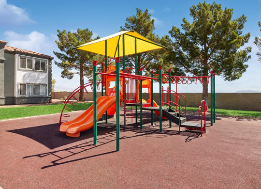 Community Playground with a Slide and Yellow Canopy at Loma Vista Apartments in Las Vegas, NV.