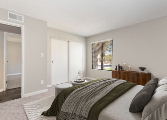 Model apartment bedroom with a large bed and a window at Saratoga Ridge, Arizona, 85022