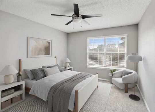Model Bedroom with Carpet and Window View at Abbington Heights Apartments in Antioch, TN.