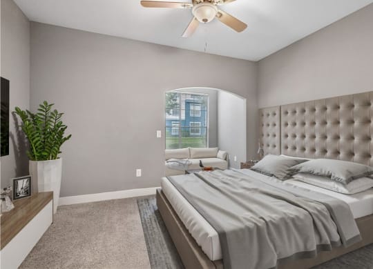 Model bedroom with lounge area with couch