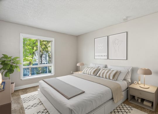 Model bedroom with queen bed and large window