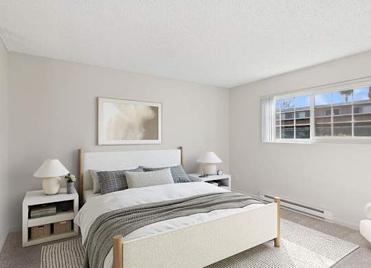 Model Bedroom with Carpet and Window View at Los Gatos Landing Apartments located in San Jose, CA.