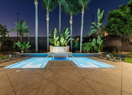 Community Hot Tubs and Lounge Furniture at Madison Park Apartments located in Anaheim, CA.