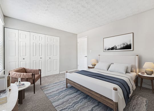 Model Bedroom with Carpet and Double Closets at Paramont Apartments in Duluth, GA.