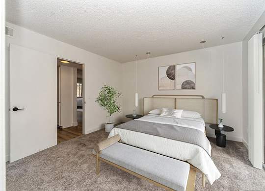 Model Bedroom with Carpet at Palmilla Apartments located in San Diego, CA.