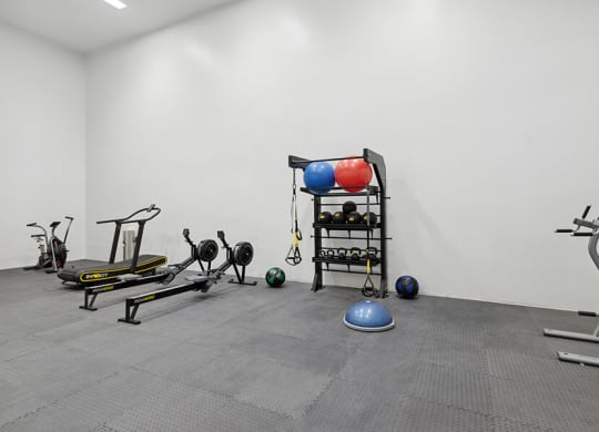 Community Fitness Center with Equipment at Hilands Apartments in Tucson, AZ.