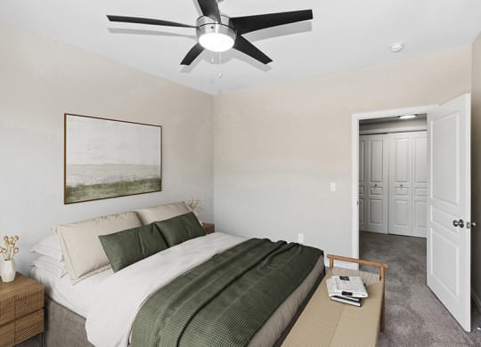 Model Bedroom with Carpet and Hallway View at Belmont at Duck Creek Apartments in Garland, TX.
