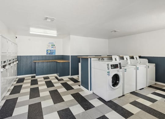 Community Laundry Center with Washing Machines and Dryers at Solano Springs Apartments located in Tucson, AZ.