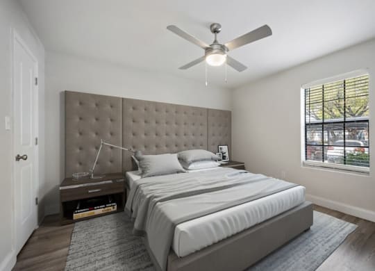 Model bedroom with window and fan