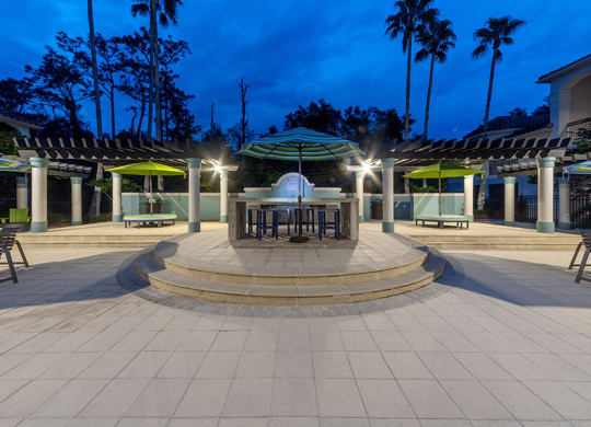 Community Patio Area with Lounge Furniture at Vinings at Hunter's Green Apartments in Tampa, FL.