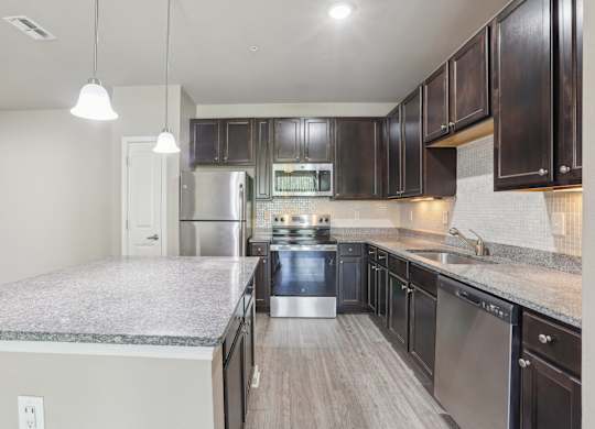 Model kitchen with stainless steel appliances.
