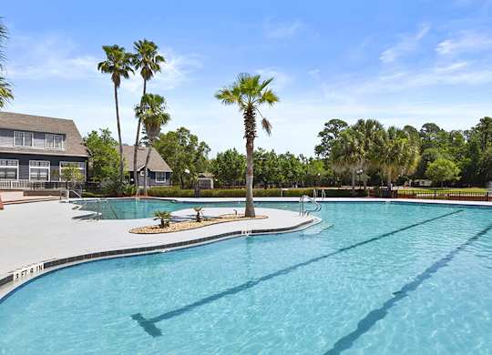 Community Swimming Pool with Pool Furniture at Mirage on Kernan Apartments located in Jacksonville, FL.