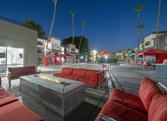 Outdoor Fire Pit Area with Lounge Furniture at Country Club Verandas Apartments located in Mesa, AZ.