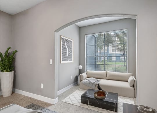 Model living room showcasing large windows