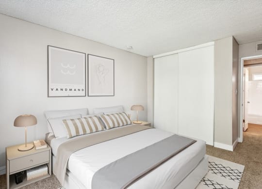 Model bedroom with a bed and two night stands