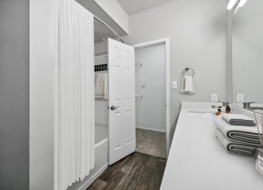Model bathroom and hallway at Bridges at Oakbend, Lewisvillle, 75067