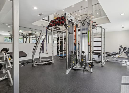 Community Fitness Center with Equipment and Upstairs Area at Dunwoody Village Apartments in Atlanta, GA.