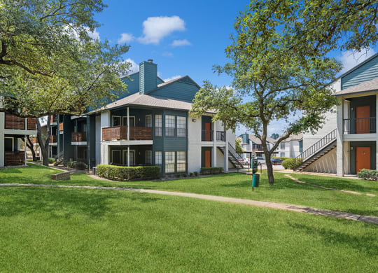 Exterior Community Building and Landscape at Bridges at Deer Run Apartments in Dallas, TX.