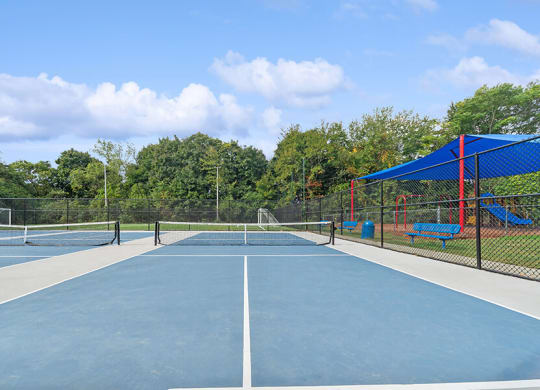 Community Pickleball Courts with Nets at Heights at Marlborough Apartments located in Marlborough, MA.
