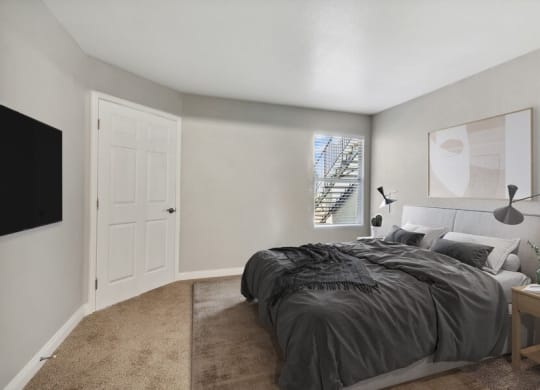 Model  bedroom with a bed and a window