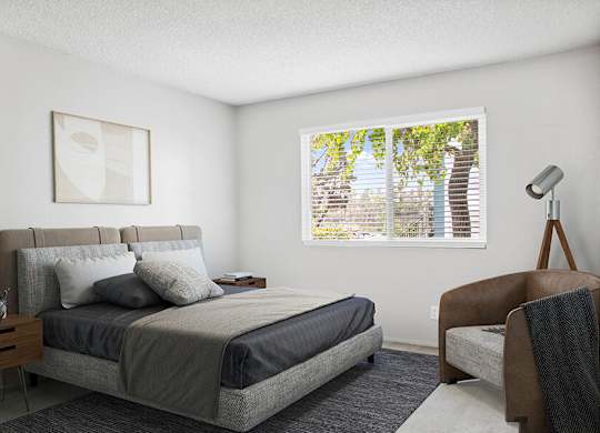 Model Bedroom with Carpet and Window View at Cove La Mesa Apartments located in La Mesa, CA.