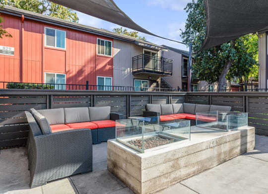 Community Fire Pit Area with Patio Furniture at The Archer Apartments in Sacramento, CA.
