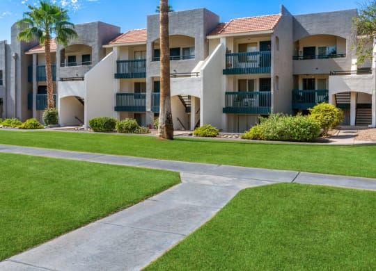 Walking path next to apartment buildings