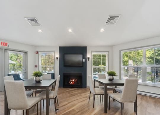 Community Clubhouse with Lounge Furniture and Fireplace at The Commons at Haynes Farm Apartments in Boston, MA.