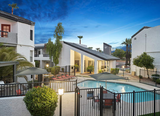 Aerial View of Community Swimming Pool and Pool Furniture at Crystal Creek Apartments located in Phoenix, AZ.