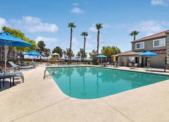 Community Swimming Pool with Pool Furniture at Loma Vista Apartments in Las Vegas, NV.