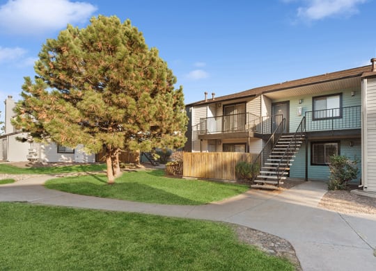 Exterior Community Building and Landscape at Liberty Creek Apartments in Aurora, CO.