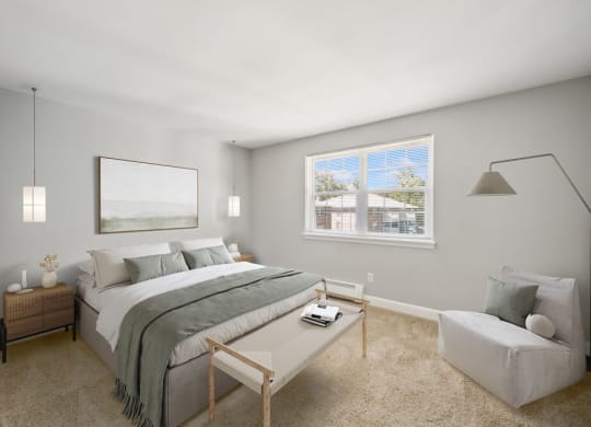 a bedroom with gray walls and a large window