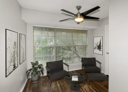 Model living room with large window at Cobblestone, Arlington, TX