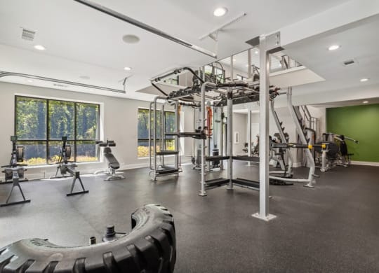 Community Fitness Center with Equipment and Upstairs Area at Dunwoody Village Apartments in Atlanta, GA.