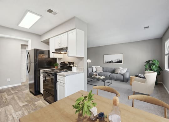 Model Kitchen with White Cabinets and Wood-Style Flooring at Spring Forest Apartments in Raleigh, NC.