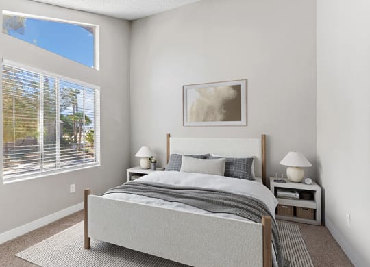Model Bedroom with Carpet and Window View at Meadow Ridge Apartments in Las Vegas, NV.