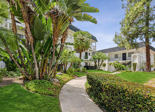 Exterior Community Building and Landscape at Palmilla Apartments located in San Diego, CA.