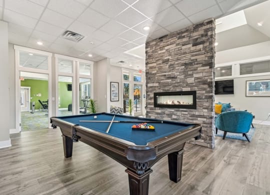 Community area with billiards table and fireplace