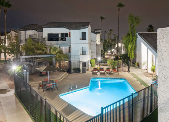 Aerial View of Community Swimming Pool and Pool Furniture at Crystal Creek Apartments located in Phoenix, AZ.