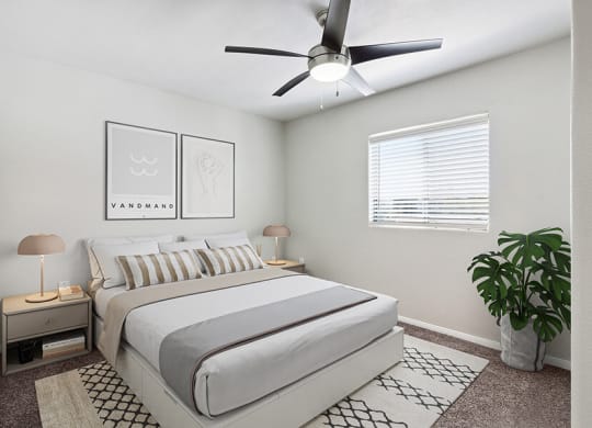 Model Bedroom with Carpet and Window View at Loma Vista Apartments in Las Vegas, NV.