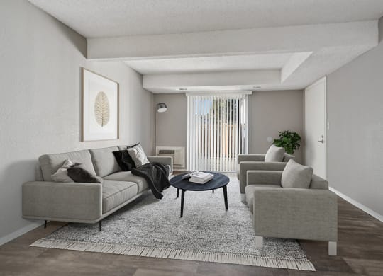 Model Living Room with Wood-Style Flooring and Patio Accessibility at Liberty Creek Apartments in Aurora, CO.