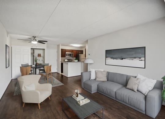 Model Living Room with Wood-Style Flooring and View of Kitchen at Mason Van Dorn Apartments located in Alexandria, VA.