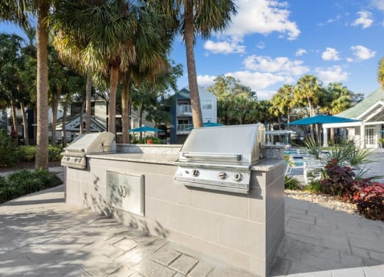 Outdoor Grilling Area at Caribbean Breeze Apartments in Tampa, FL.