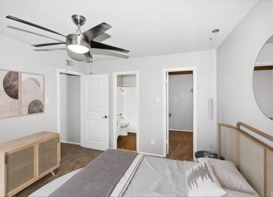 Model primary bedroom with walk-in closet