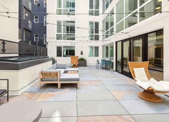 Outdoor lounge with patio furniture at TL Residences