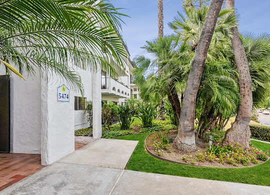 Exterior Community Building and Landscape at Palmilla Apartments located in San Diego, CA.