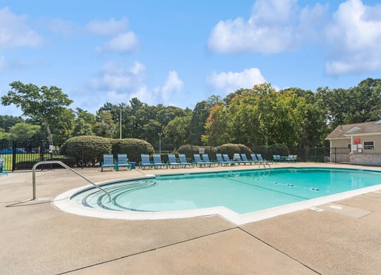 Community Swimming Pool with Pool Furniture at Meadows at Marlborough Apartments in Boston, MA.