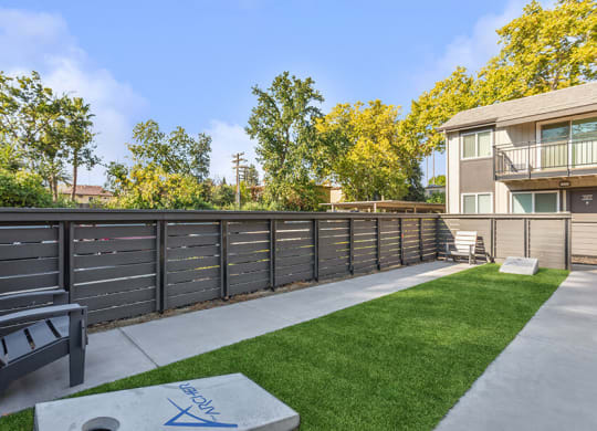 Outdoor Corn Hole Area at The Archer Apartments in Sacramento, CA.